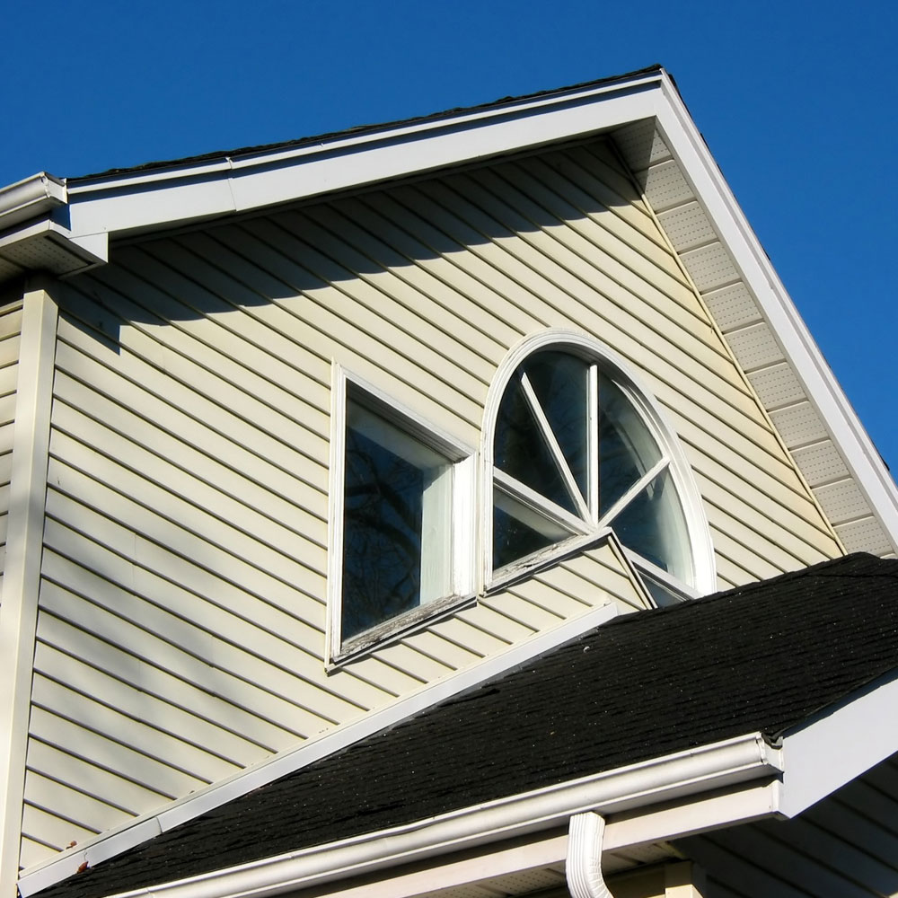 Modern home exterior with new siding installation